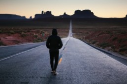 walking in the middle of the road in the desert