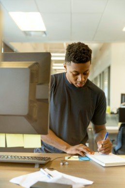 young left handed male at computer